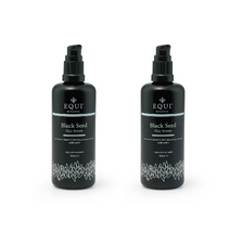 Two black bottles of EQUI black seed hair serum with pump dispensers.