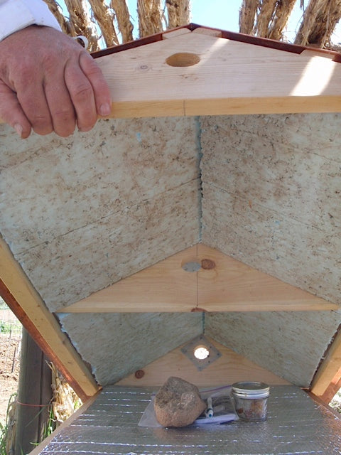 Storage area under Top Bar Hive roof