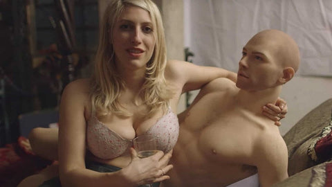 Female holding male sex doll
