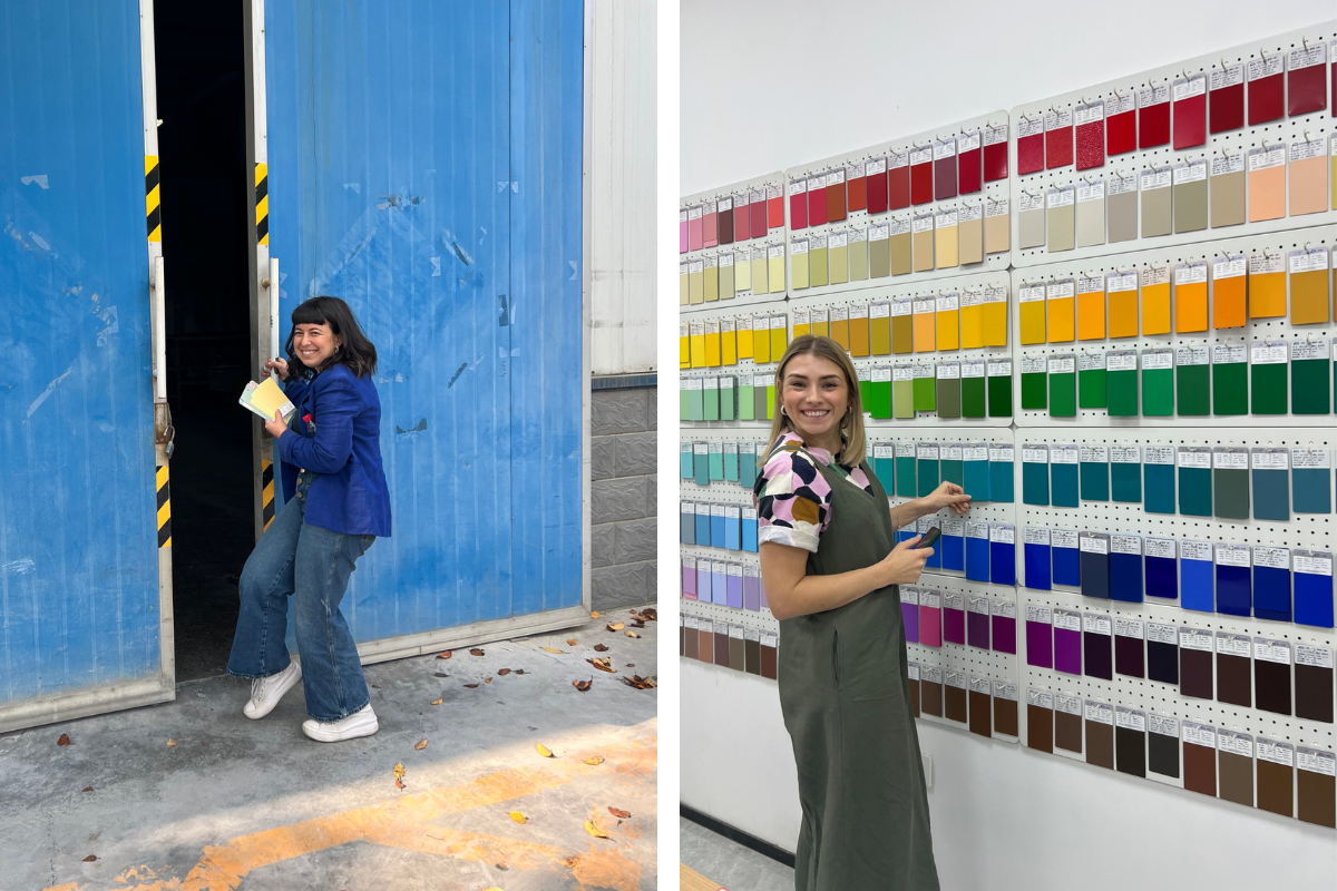 Becca smiles cheekily as she opens the doors to the factory, while Kate smiles at a whole wall of colour swatches!