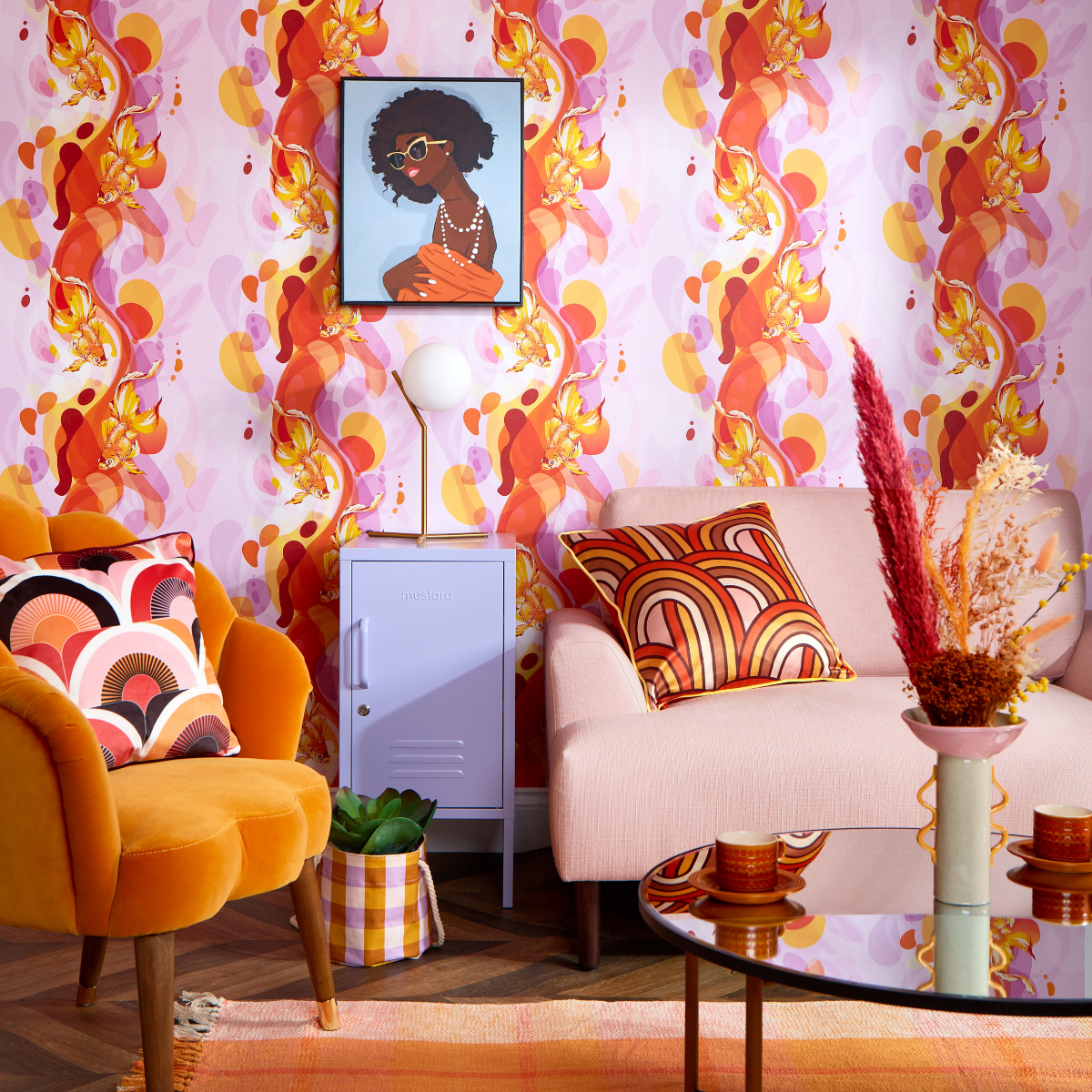 A lilac and orange themed lounge room features bold colours and clashing patterns. There is a goldfish-print wallpaper, velvet chair and Lilac Shorty locker.