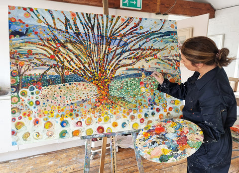 Dawn Crothers painting one of her Snail Tree original oil paintings in her studio.jpg