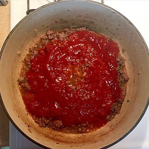Add tomato and pepper puree to chili recipe