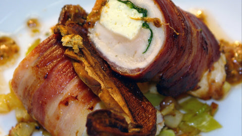 Appetizers - Bacon-wrapped chicken stuffed with cheese and spinach (closeup)