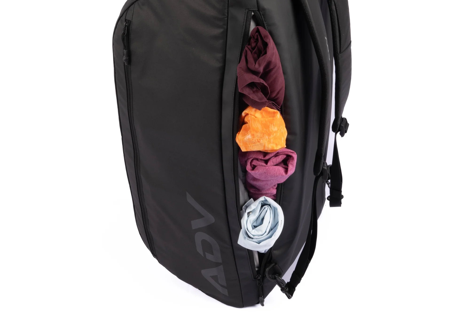 Black backpack with colorful clothes packed in a side zipper pocket.