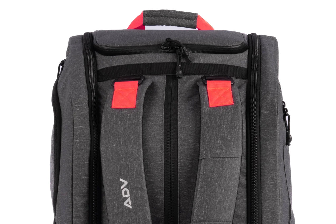 Gray backpack with red accents and 'ADV' printed on the strap.