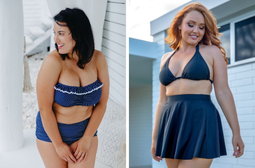 Woman with dark brown hair wears navy and white polkadots strapless bandeau bikini top and retro skirted high waist pant. Woman with long red hair wears black triangle bikini top and black skater skirt. 