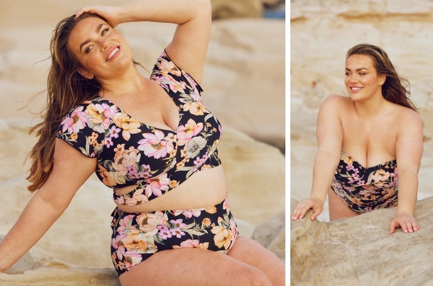 Woman with long brown hair wears black and pink floral crop wrap bikini top with high waisted pants.