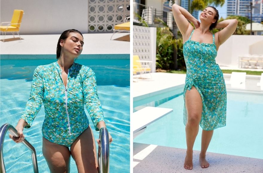 Woman with short brown hair poses by the pool wearing Calypso aqua swimwear