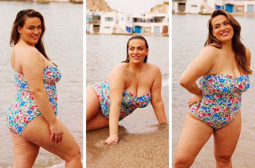 Woman with long brown hair wears strapless one piece swimsuit with bright floral print