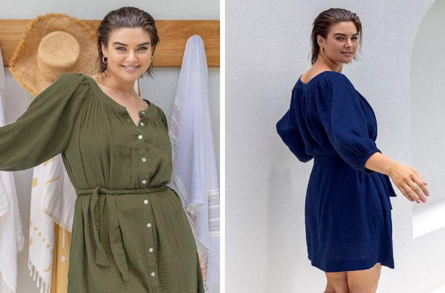 Woman with short brown hair wears cheesecloth button through dress in khaki and navy