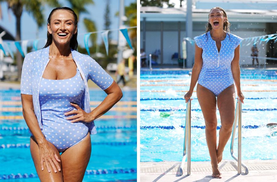 Woman stands by the pool wearing powder blue and white polkadot short sleeve rashie and one piece swimsuit. Woman exists the pool wearing powder blue frill sleeve zip front one piece