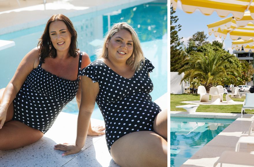 Two women sit by the pool wearing black and white polka dot print one piece swimsuits