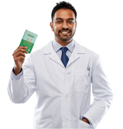 Pharmacist holding A-Z Multivitamins in green. Pharmacist wearing white lab coat