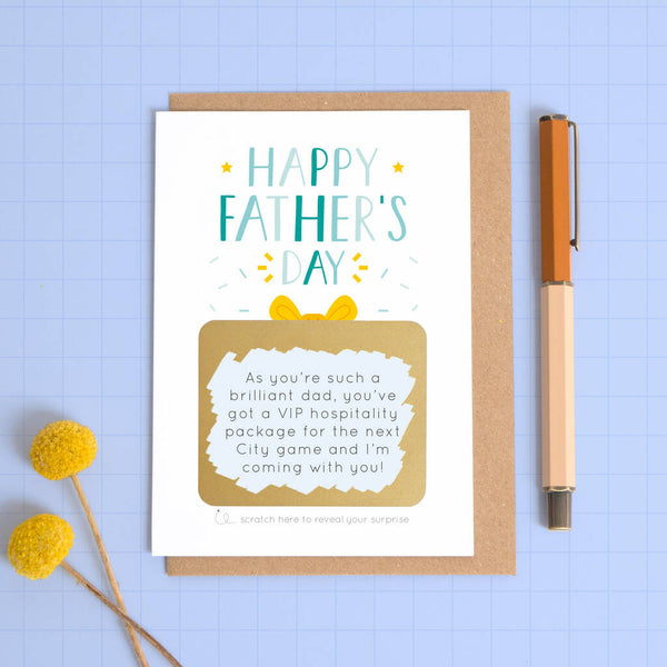 A personalised Father's day scratch card where the gold panel has been scratched to reveal the gift.