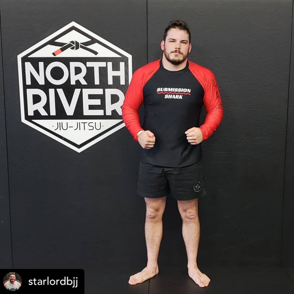 Josh Leduc at North River Jiu-JItsu Academy wearing a red Submission Shark BJJ Rash Guard