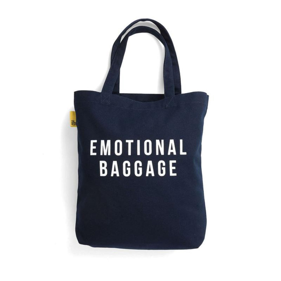 A navy tote bag has "emotional baggage" capitalised in a white sans-serif font. 