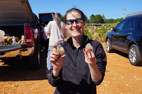 Female Holding Crystals Cars In Background