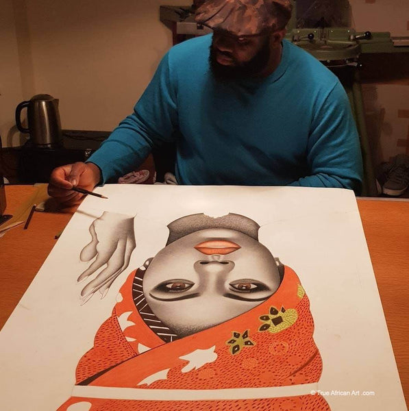 Michael Oguguo in the process of making one of his original paintings.