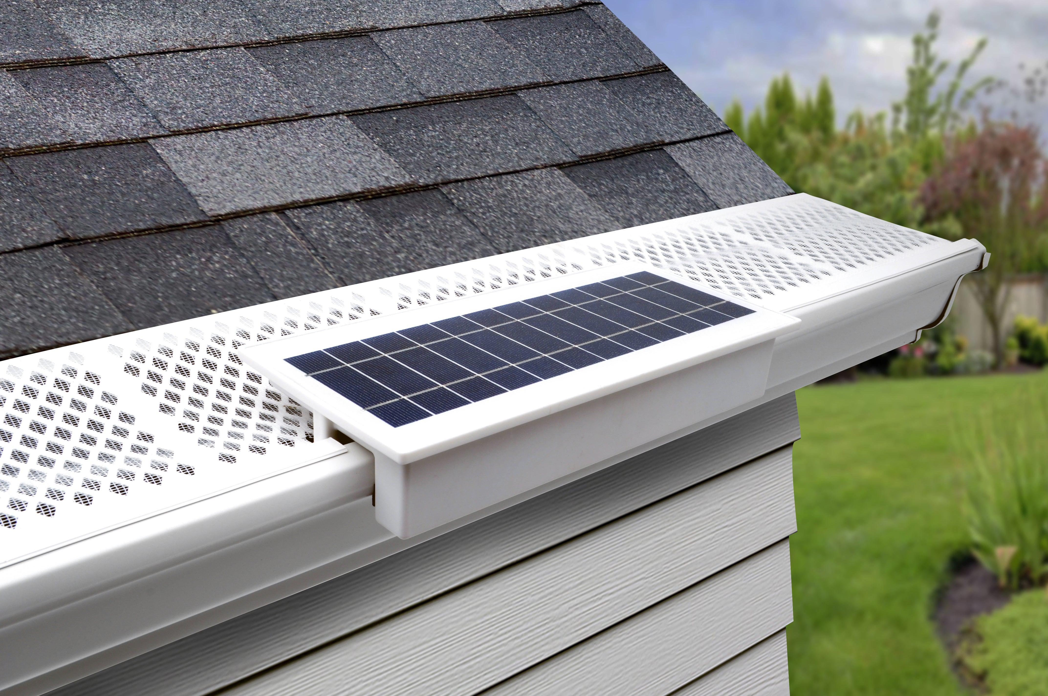 EZ Home Security FloodLight mounted on a white gutter with gutter guard.