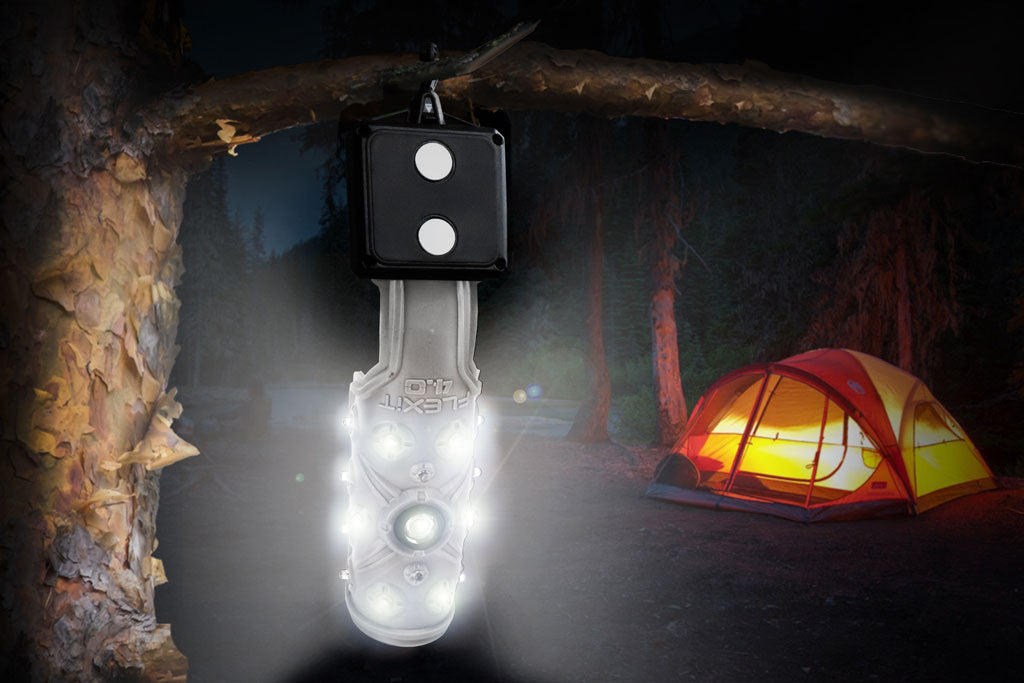 https://cdn.shopify.com/s/files/1/2280/6129/files/STKR-flexit-4.0-hanging-from-a-tree-and-bent-in-a-cylinder-to-give-360-degree-lighting-with-tent-and-campsite-in-background_1024x1024.jpg?v=1614341517