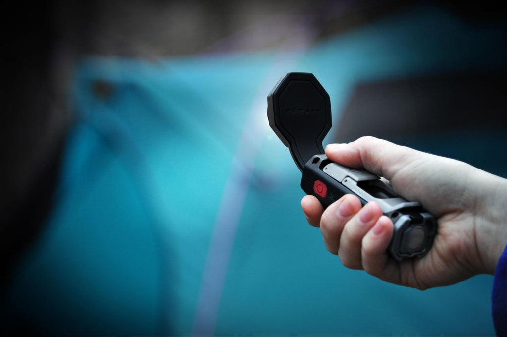 flexit pocket flashlight illuminating an out of focus tent in BG by STKR Concepts