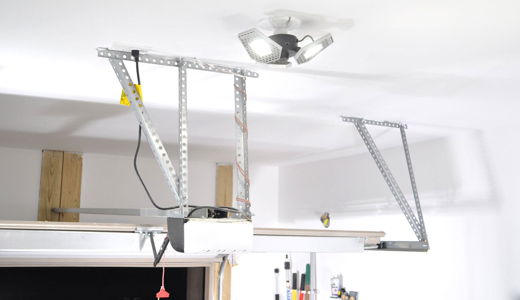 STKR Concepts TRiLIGHT Motion Sensing Light Bulb in Garage - Striker