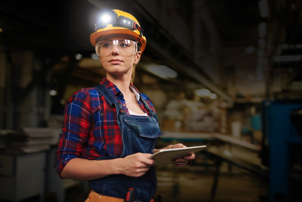 young woman wearing hard hat w flexit headlamp 2.5 by STKR Concepts