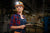 Young woman wearing a hard hat with a FLEXIT headlamp 2.5 by STKR Concepts