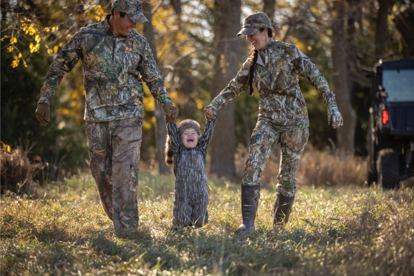 Family-with-Child-Wearing-Camo-Walking-Through-a-Field-in-the-Fall-Ranger-Ready-Repellents