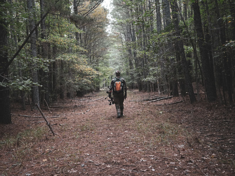 photo-hunter-walking-in-forest