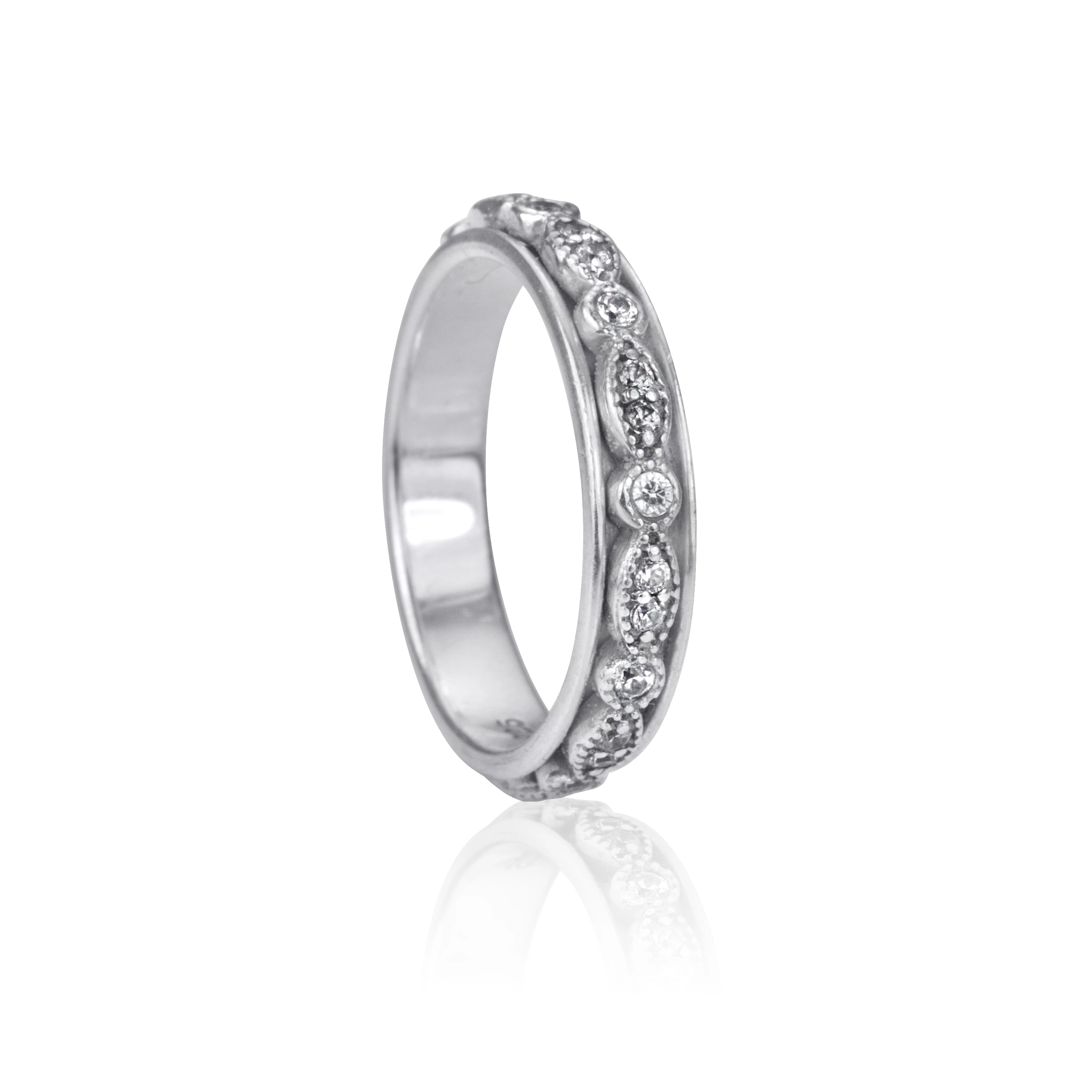Devotion Meditation Ring featuring a silver band adorned with clear crystal stones, representing commitment and mental clarity.