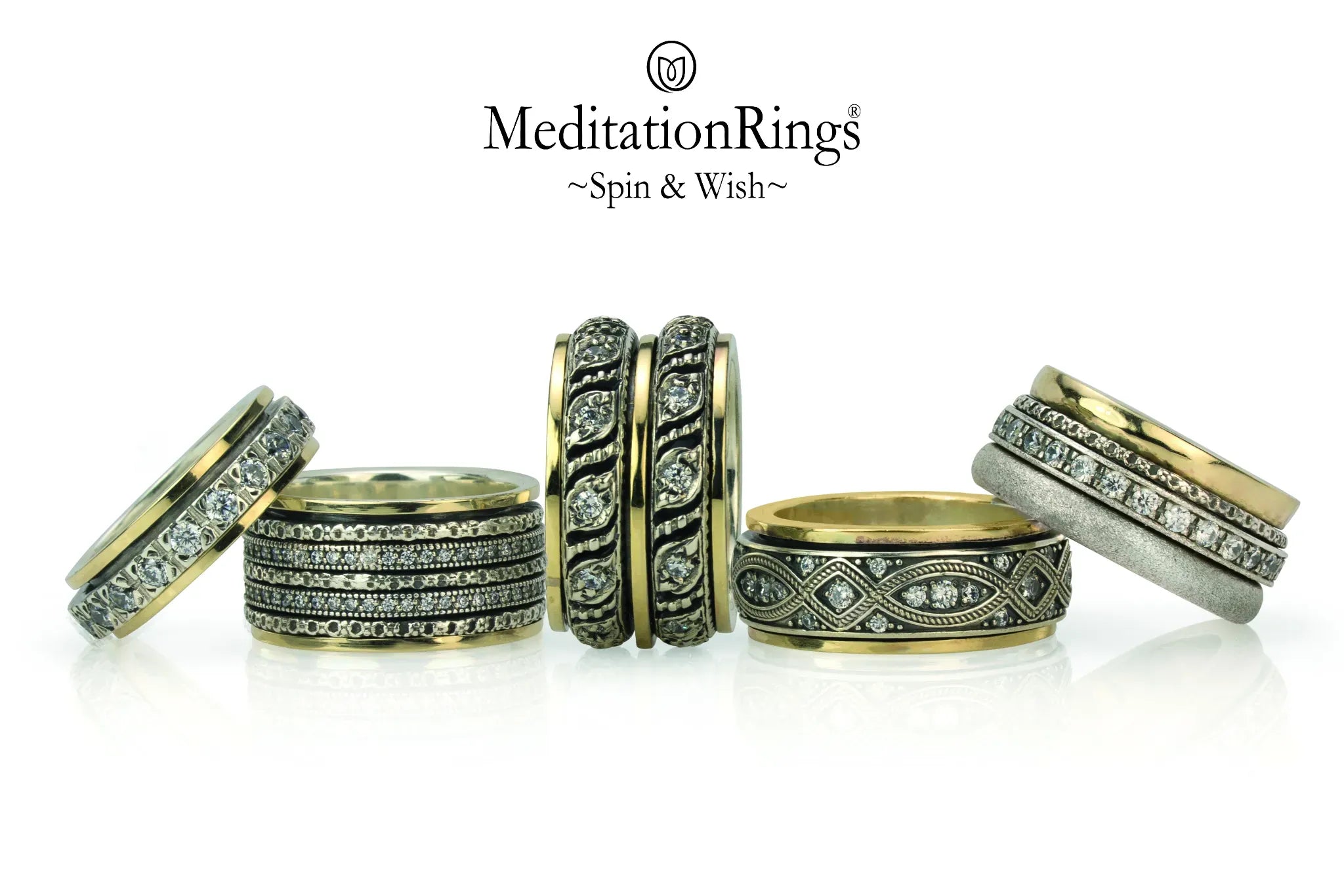 Collection of gold spinner rings with intricate spinning bands, showcasing calming design