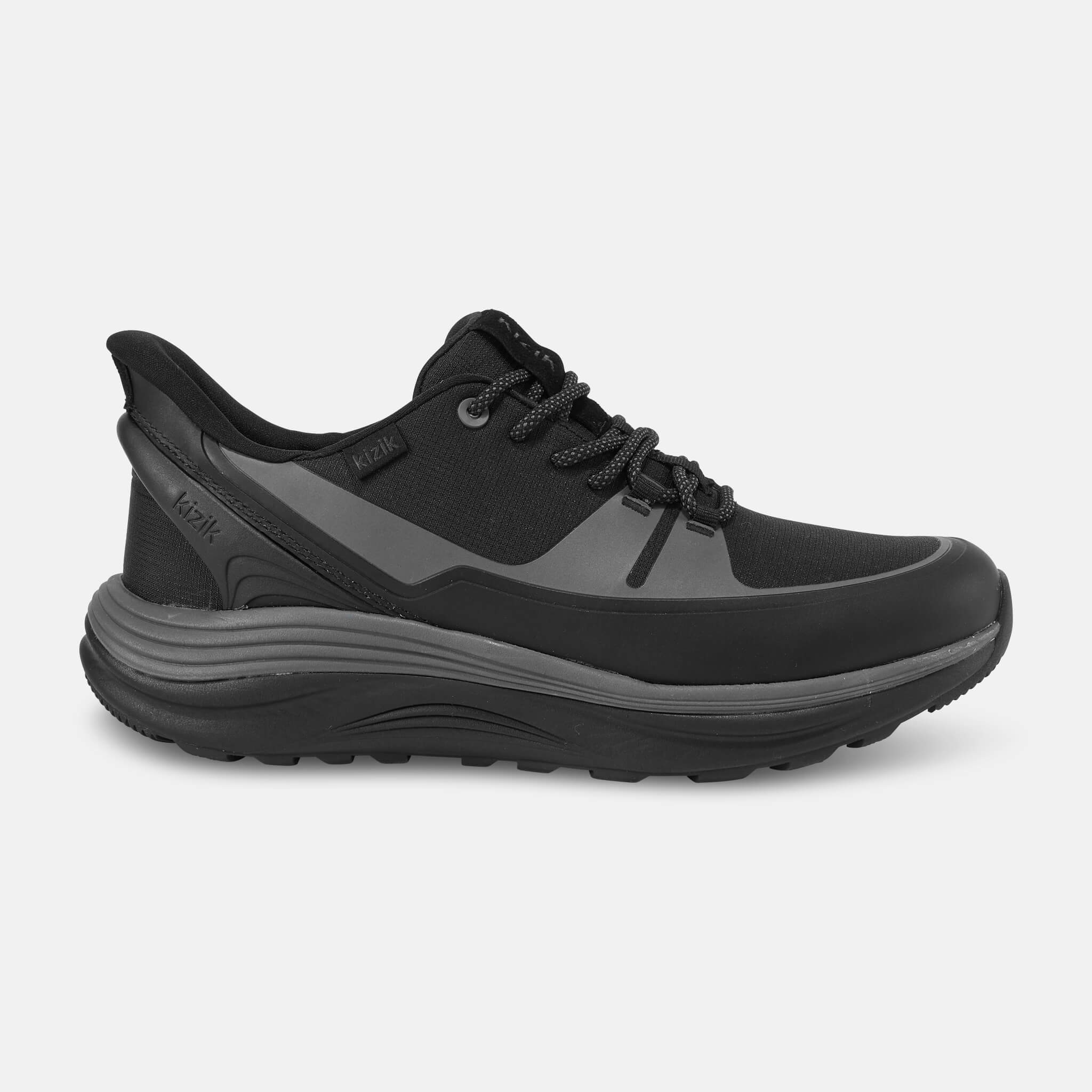 Black athletic shoe with laces and a thick sole, side view.
