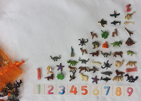 A counting activity using Safari Ltd Good Luck Mini figures