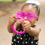 girl holding bangle in heart sunglasses