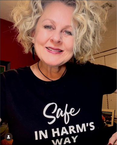 Woman wearing CLOZTALK t-shirt showing Safe In Harms Way 