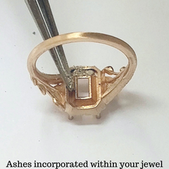 inserting cremation ashes within a rose gold ring