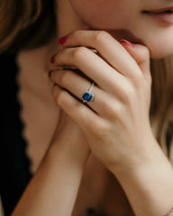 radiant cut sapphire engagement ring with diamond halo