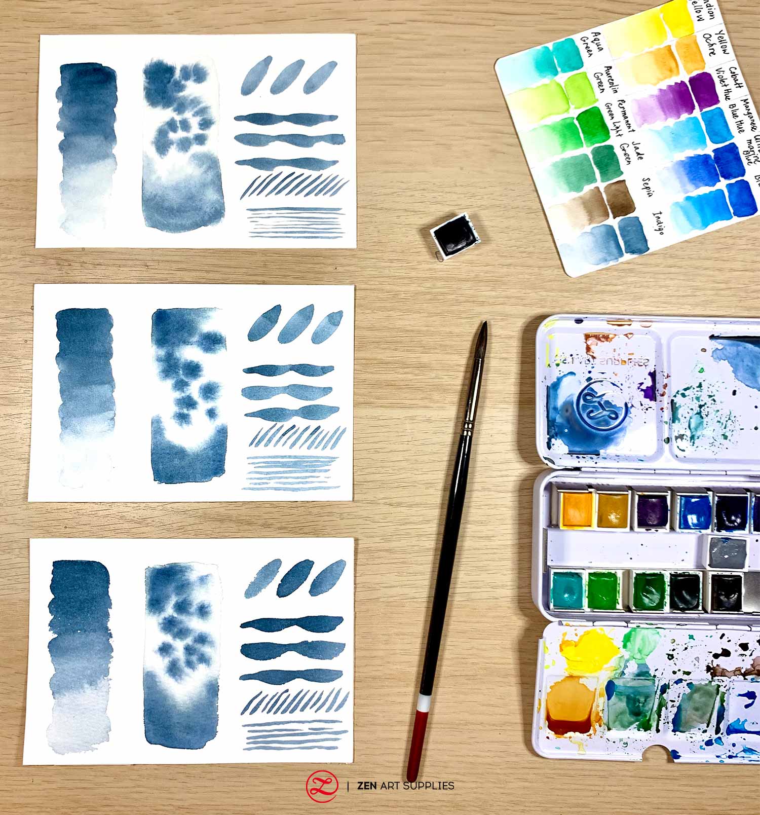 Three different textures of watercolor paper tested out using indigo watercolor paint and a #5 round brush.