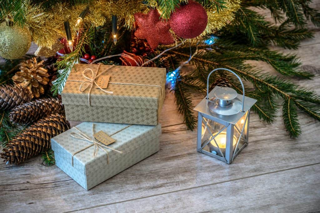 Christmas presents, lit lantern, Christmas tree