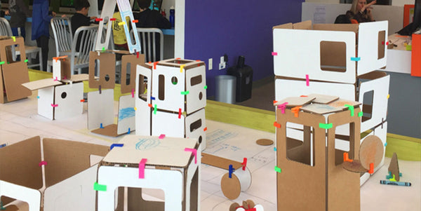 cardboard construction creating a city with urban planning curriculum