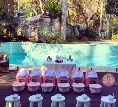 pink spa party set up in a backyard for a girls party