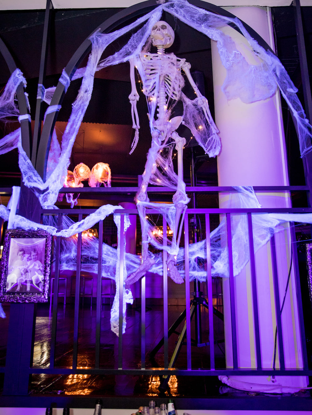 Halloween Ideas: Hanging Skeleton wrapped in web and spiders