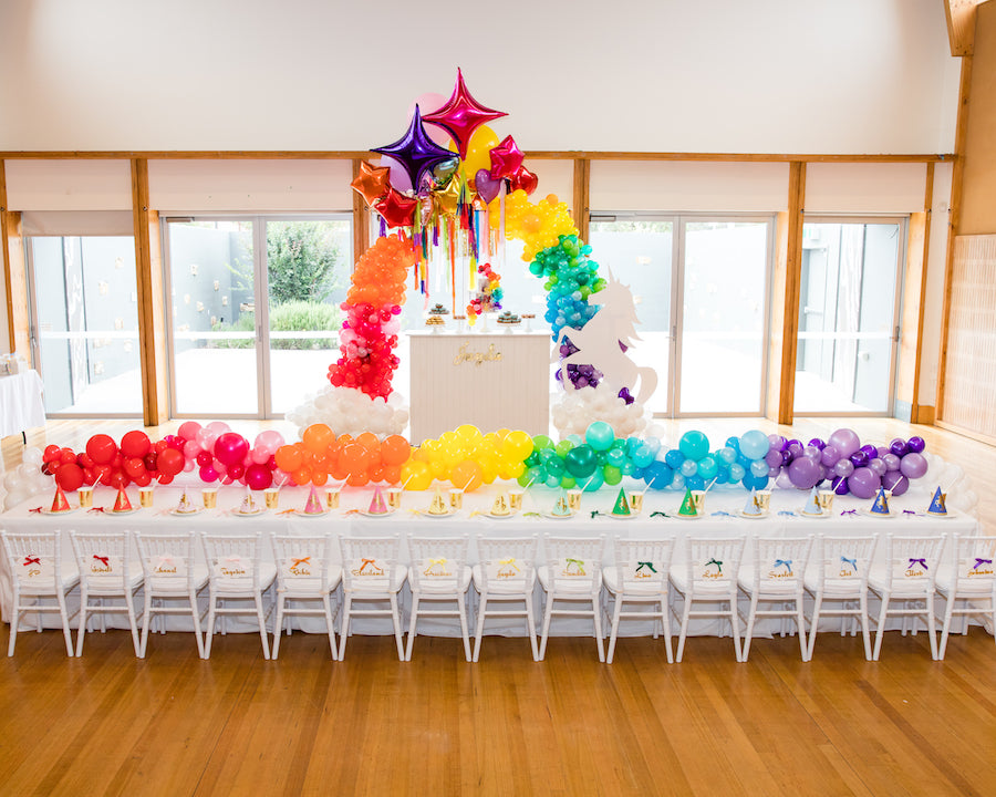 Unicorn Kids Party Set Up; Kids table with Unicorn Cake and Unicorn Prop feature