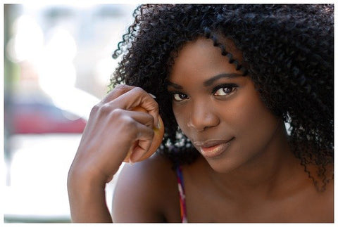 african american woman wearing curly wig