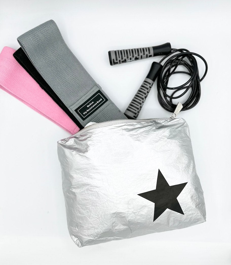 Medium silver zipper pouch with gym bands and jump rope