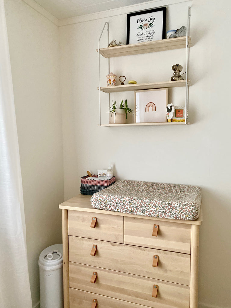 Scandinavian Nursery - white walls, wooden dresser and shelves, simple accents
