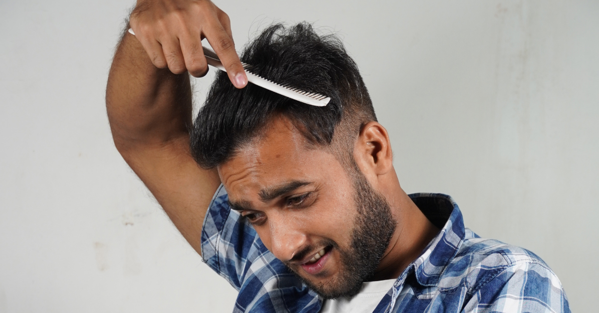man combing his hair