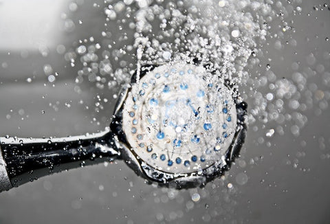 A shower head with the water on